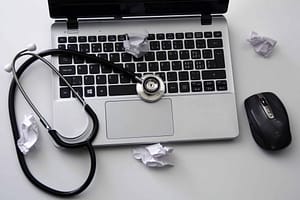 computer and mouse with stethoscope